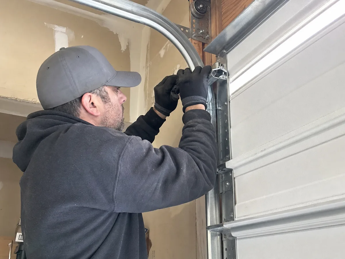 Garage Door repair technician on the job in Signal Hill, CA